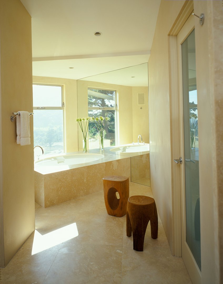 Bathroom of Mulholland Drive modern home featuring soaking tub and artful foot stools, full-service interior design by Stephen Pappas Interiors, Los Angeles