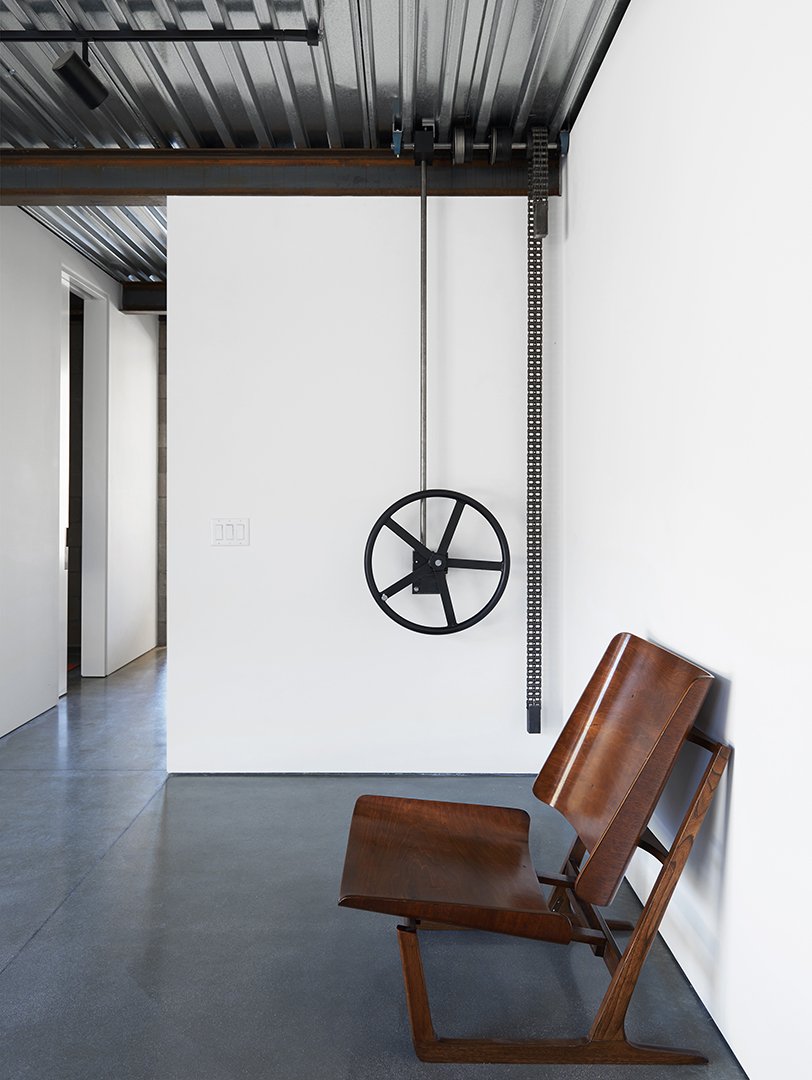 Hallway interior of Tom Kundig Sawmill House in Tehachapi, California, featuring minimalist wooden seating, styled by Stephen Pappas Interiors for Princeton Architectural Press book "Tom Kundig Works"