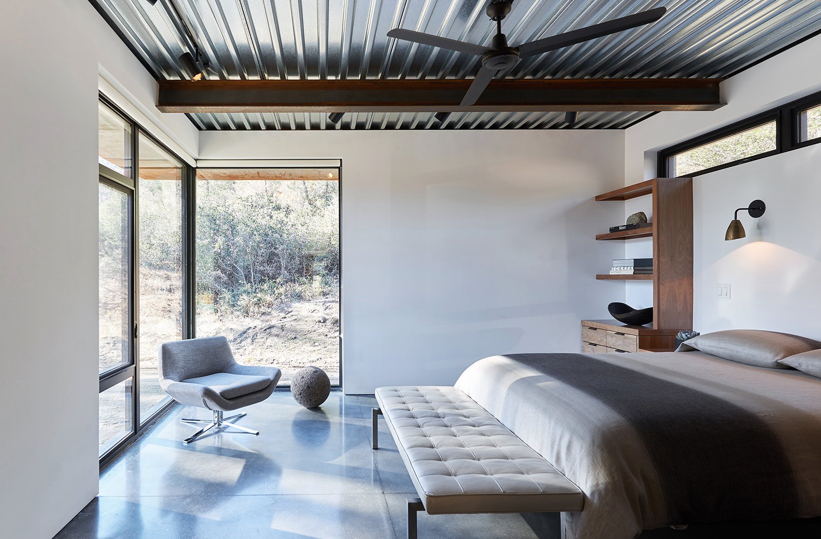 Bedroom interior from alternative angle of Tom Kundig Sawmill House in Tehachapi, California, featuring minimalist furnishings and curated accessories, styled by Stephen Pappas Interiors for Princeton Architectural Press book "Tom Kundig Works"