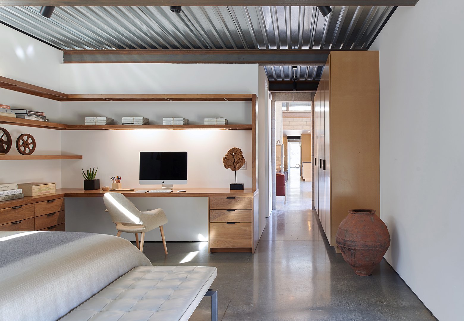Dappled light bedroom interior of Tom Kundig Sawmill House in Tehachapi, California, featuring minimalist furnishings and curated accessories, styled by Stephen Pappas Interiors for Princeton Architectural Press book "Tom Kundig Works"