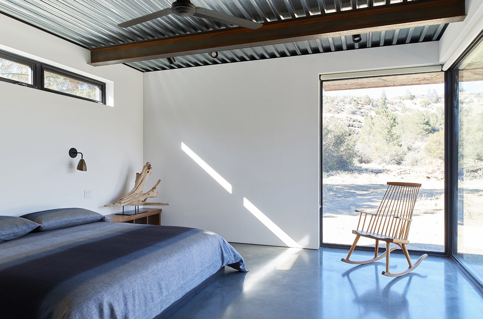 Alternative angle of bedroom interior detail of Tom Kundig Sawmill House in Tehachapi, California, featuring minimalist furnishings and curated accessories, styled by Stephen Pappas Interiors for Princeton Architectural Press book "Tom Kundig Works"