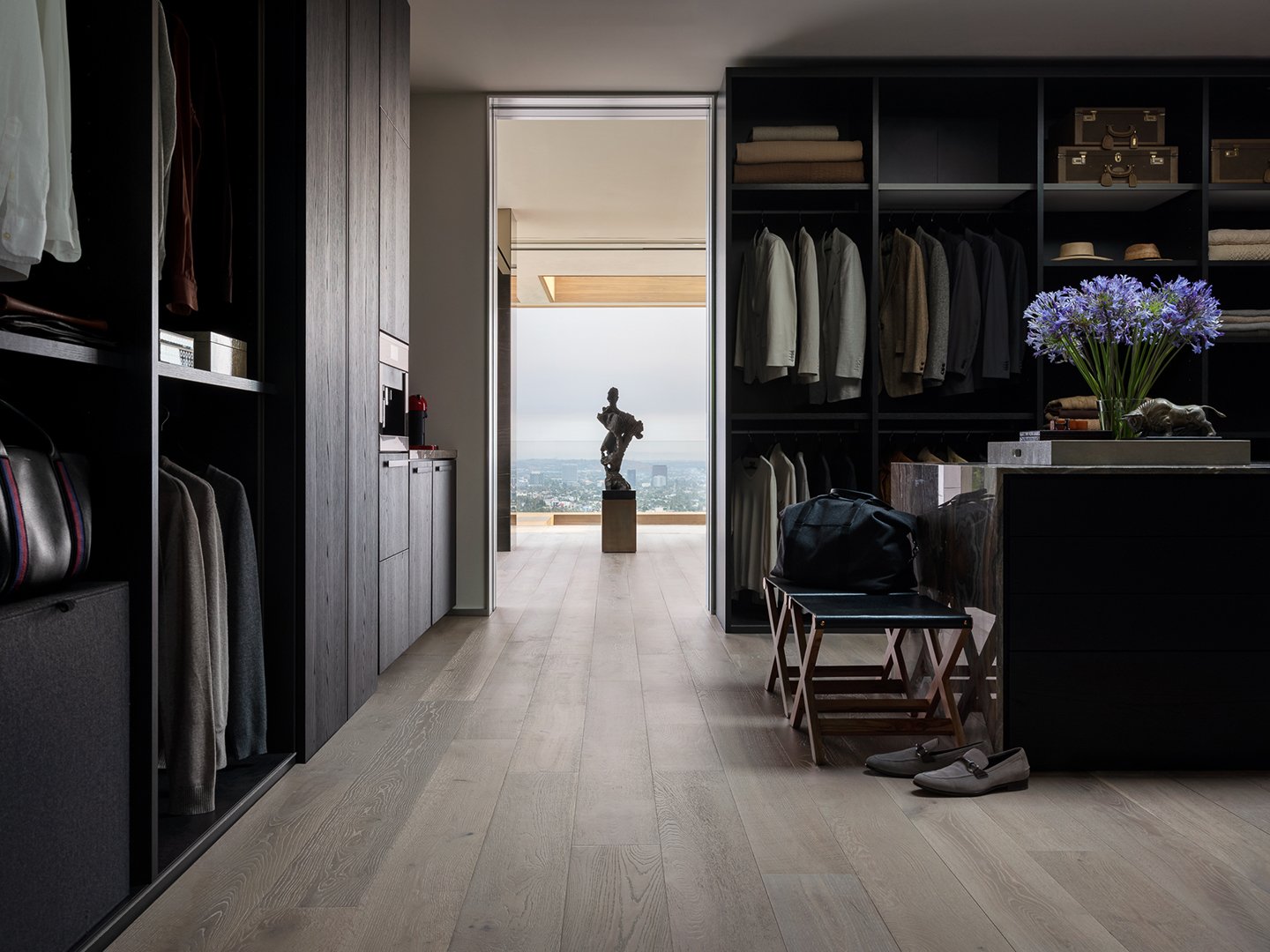 Interior styling of a luxury walk in closet for California Classic Floors featuring elegant accents and an abstract sculpture styled by Stephen Pappas Interiors, photographed by Roger Davies