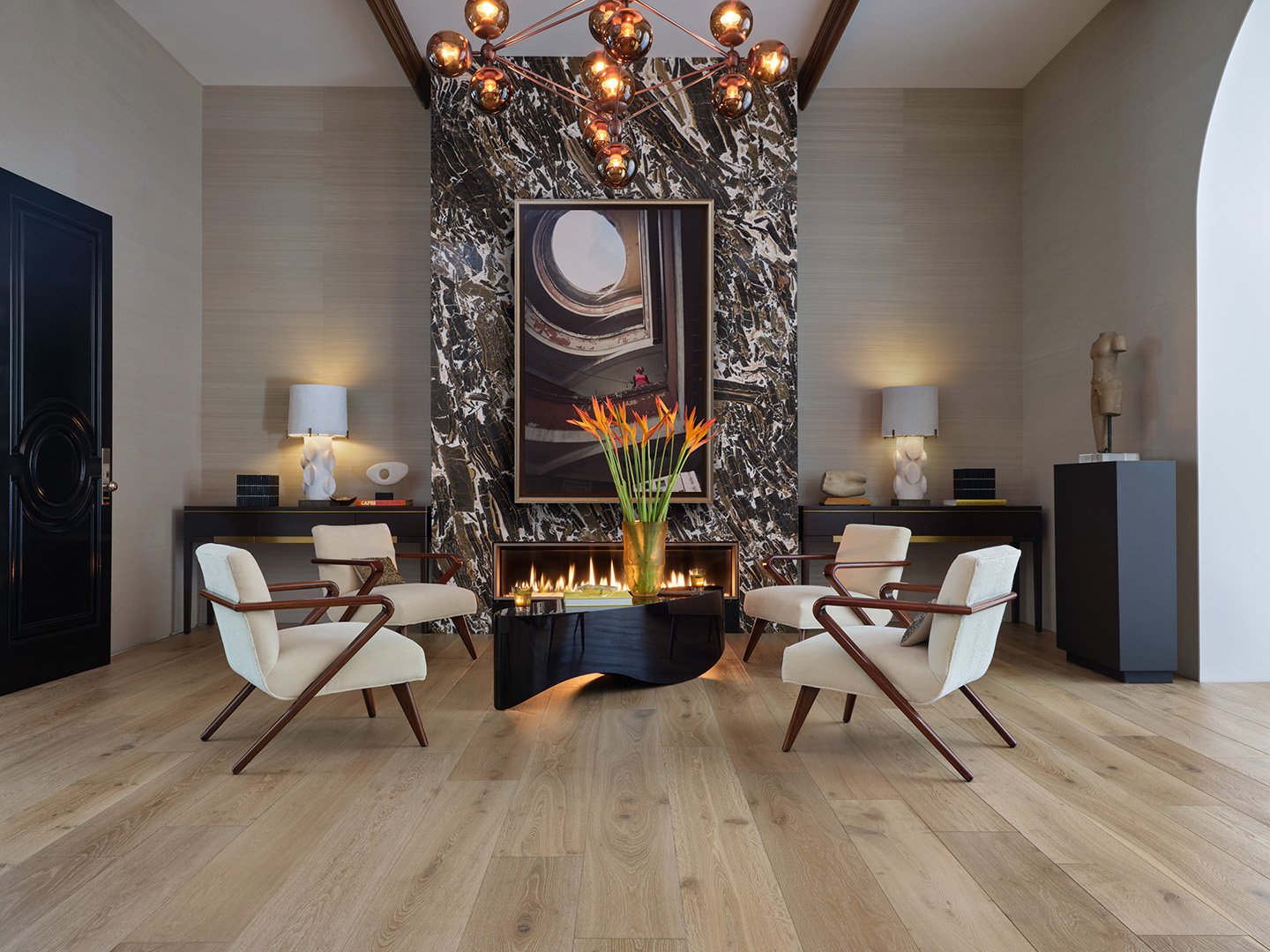 Interior styling of a luxury sitting room for California Classic Floors featuring a large marble wall, custom lighting and modern upholstered seating, styled by Stephen Pappas Interiors, photographed by Roger Davies