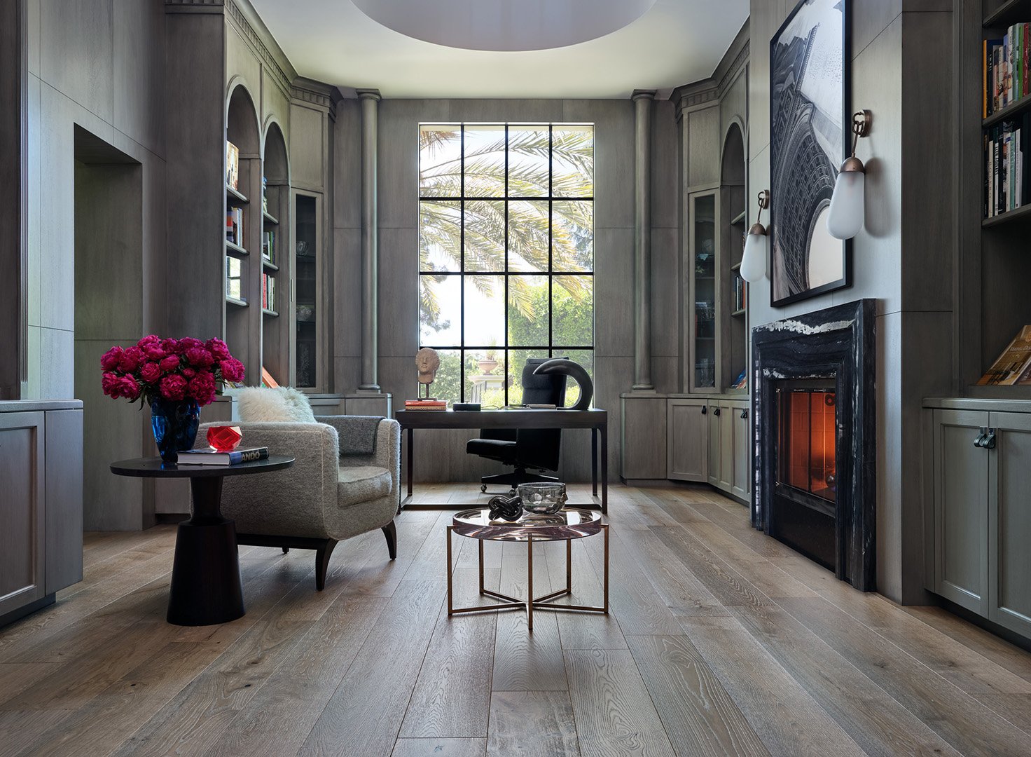 Interior styling of a sitting room for California Classic Floors featuring custom upholstered chair, modern side tables and an in-wall fireplace, styled by Stephen Pappas Interiors, photographed by Roger Davies