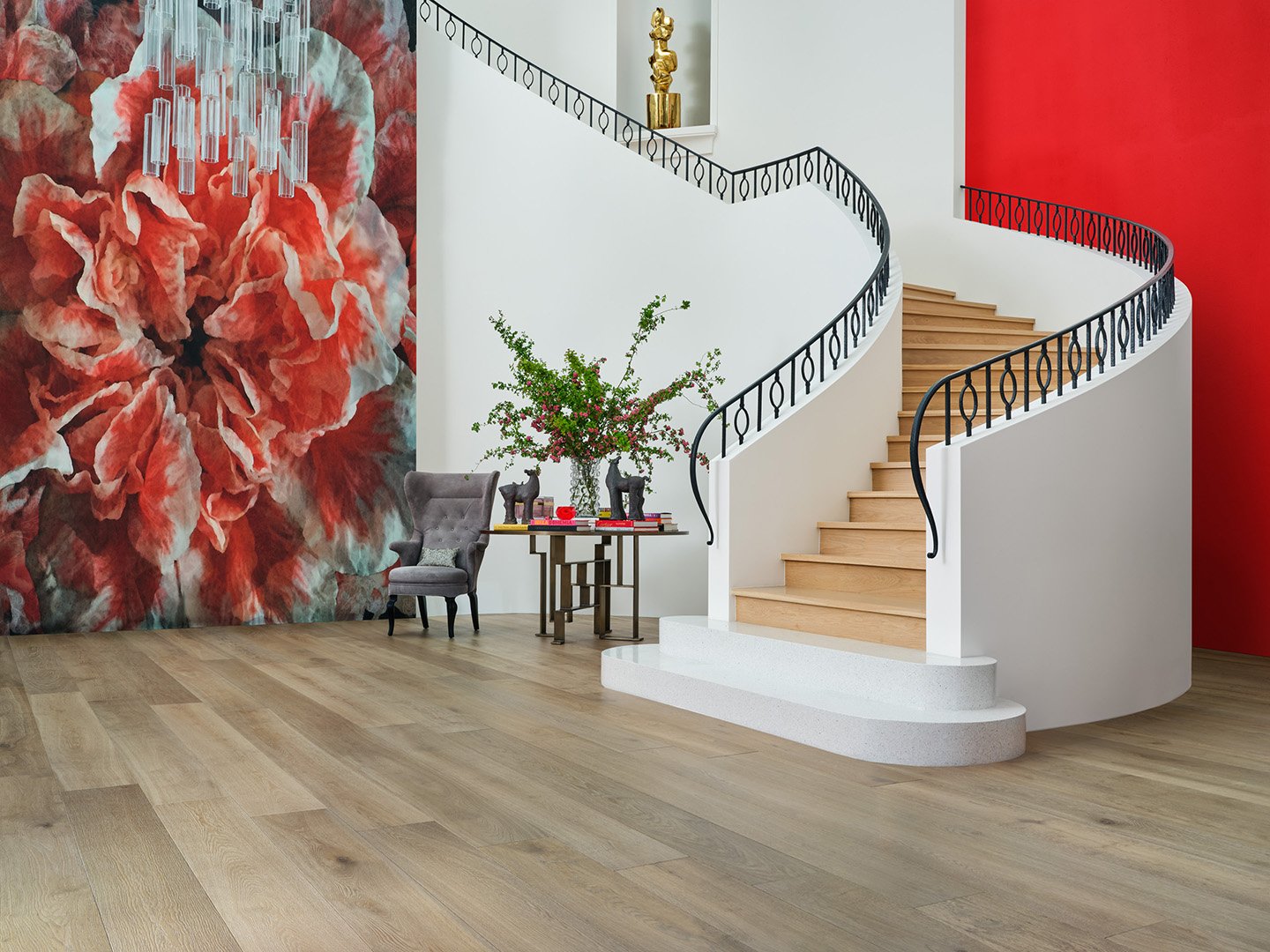 Interior styling of a luxury entry way and staircase for California Classic Floors featuring custom wallpaper, an elegant chandelier, modern upholstered seating and accents, styled by Stephen Pappas Interiors, photographed by Roger Davies