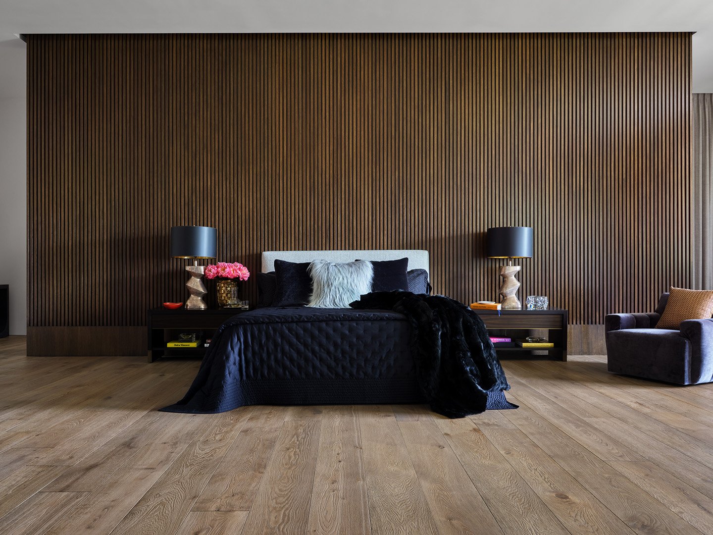 Interior styling of a luxury bedroom for California Classic Floors featuring custom upholstery, modern accents and bedding, backed by a large wood slat wall, styled by Stephen Pappas Interiors, photographed by Roger Davies