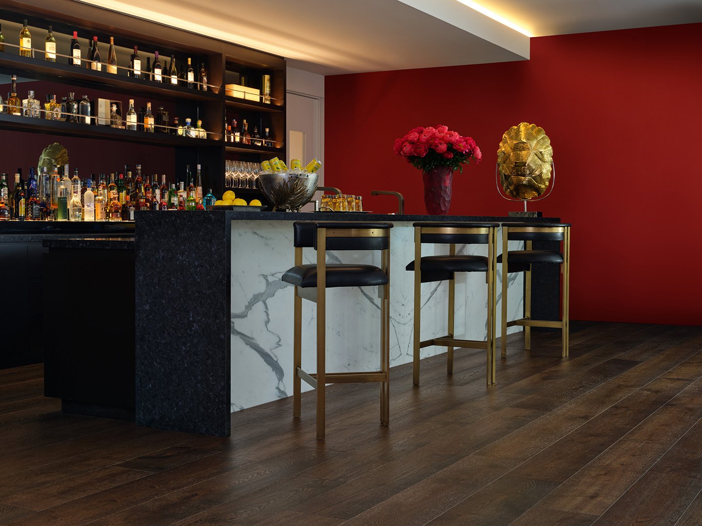 Interior styling of a modern wet bar for California Classic Floors featuring custom bar stools, a marble island and countertop, and artful accents, styled by Stephen Pappas Interiors, photographed by Roger Davies